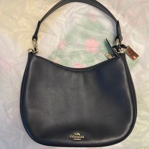 Coach Navy leather shoulder bag.